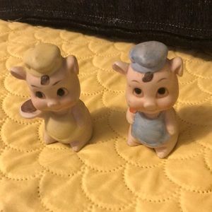 A pair of vintage ceramic pigs